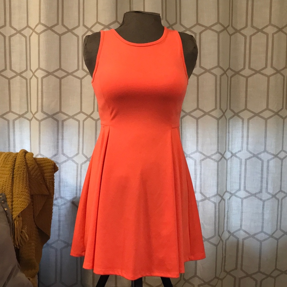 Sleeveless, hot pink midi dress.